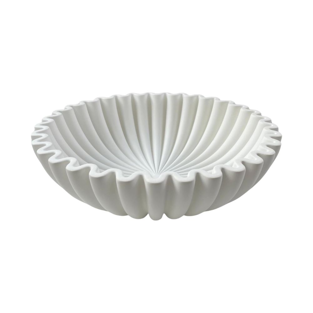 White fluted decorative bowl used as a stylish catchall or centerpiece