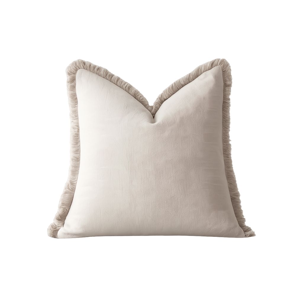 neutral throw pillow with fringe detail for cozy home decor