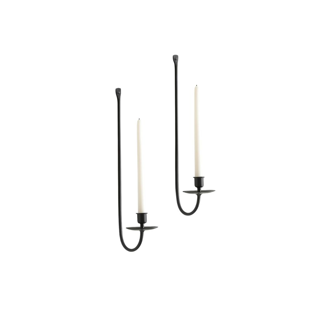 Minimal black wall candle sconces with taper candles and curved metal detailing