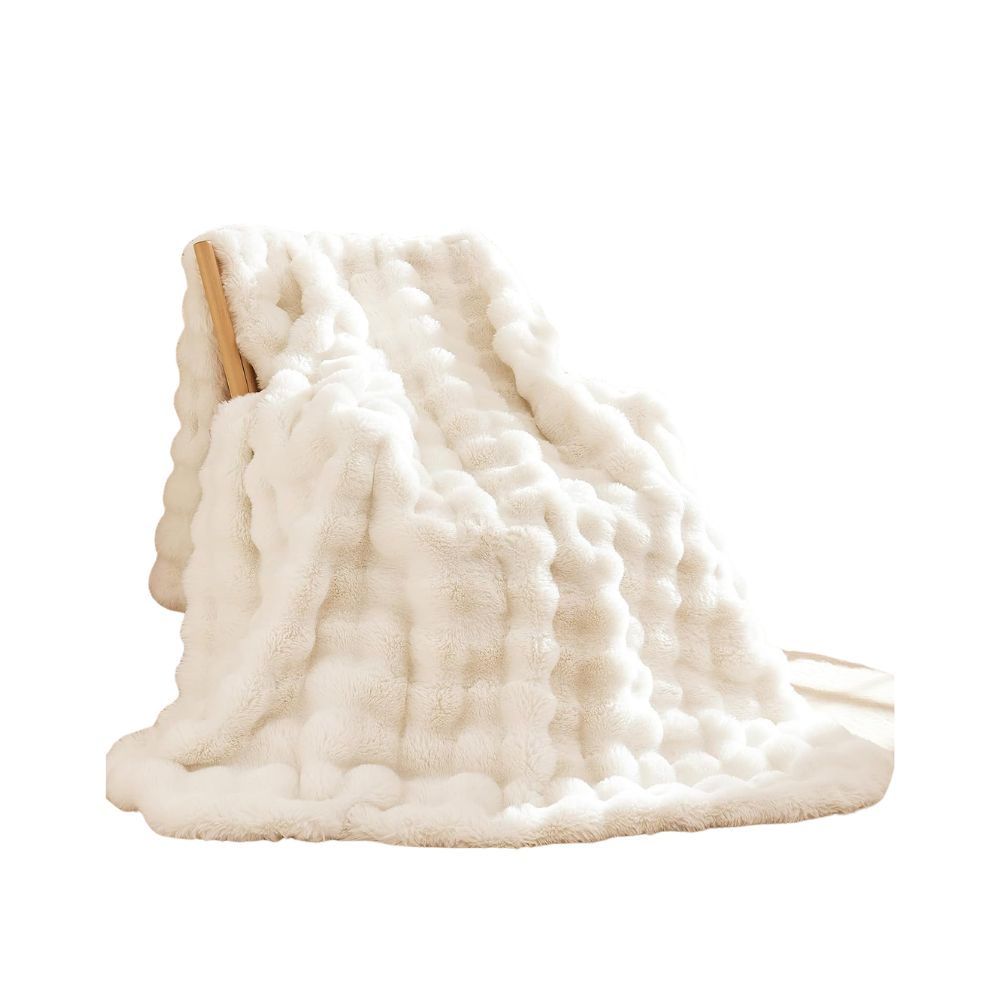 Cream faux fur throw blanket for adding an extra cozy layer to a guest bed