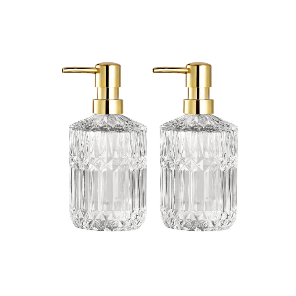 Glass soap dispensers with gold pumps for a guest bathroom